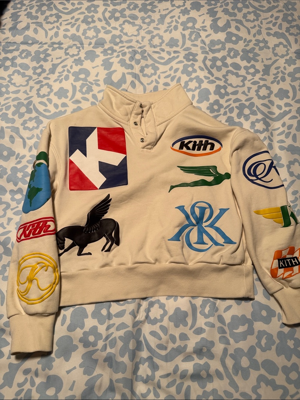 Kith Cream Crewneck Sweatshirt with Multi-Color Logo Patches
